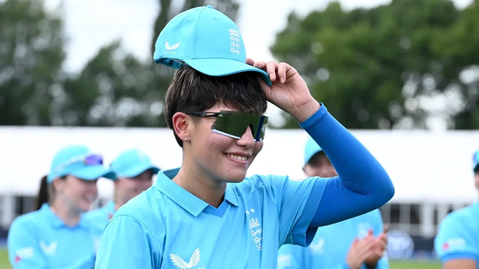 Player adjusting cap during team warm-up session