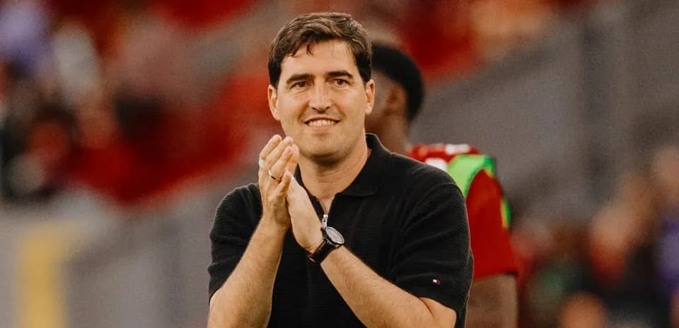 Coach clapping during a match on the sidelines