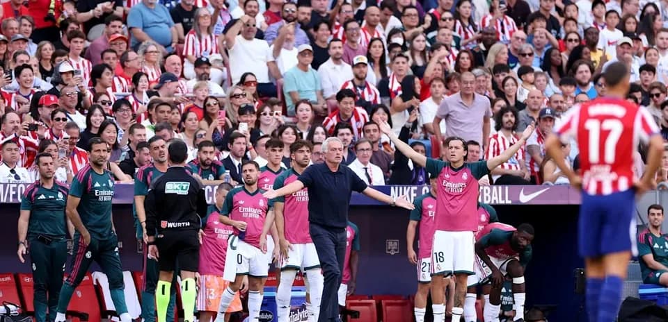 Coach giving instructions to players on bench