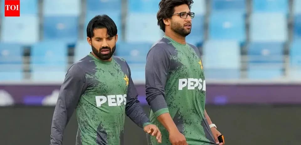 Two cricketers walking on training ground