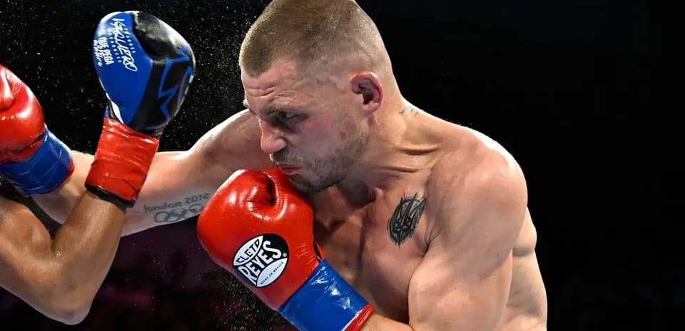 Boxer throwing a punch during a match