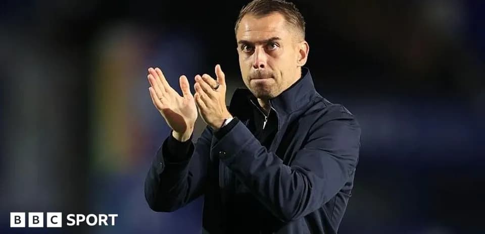 Manager applauding during a football match