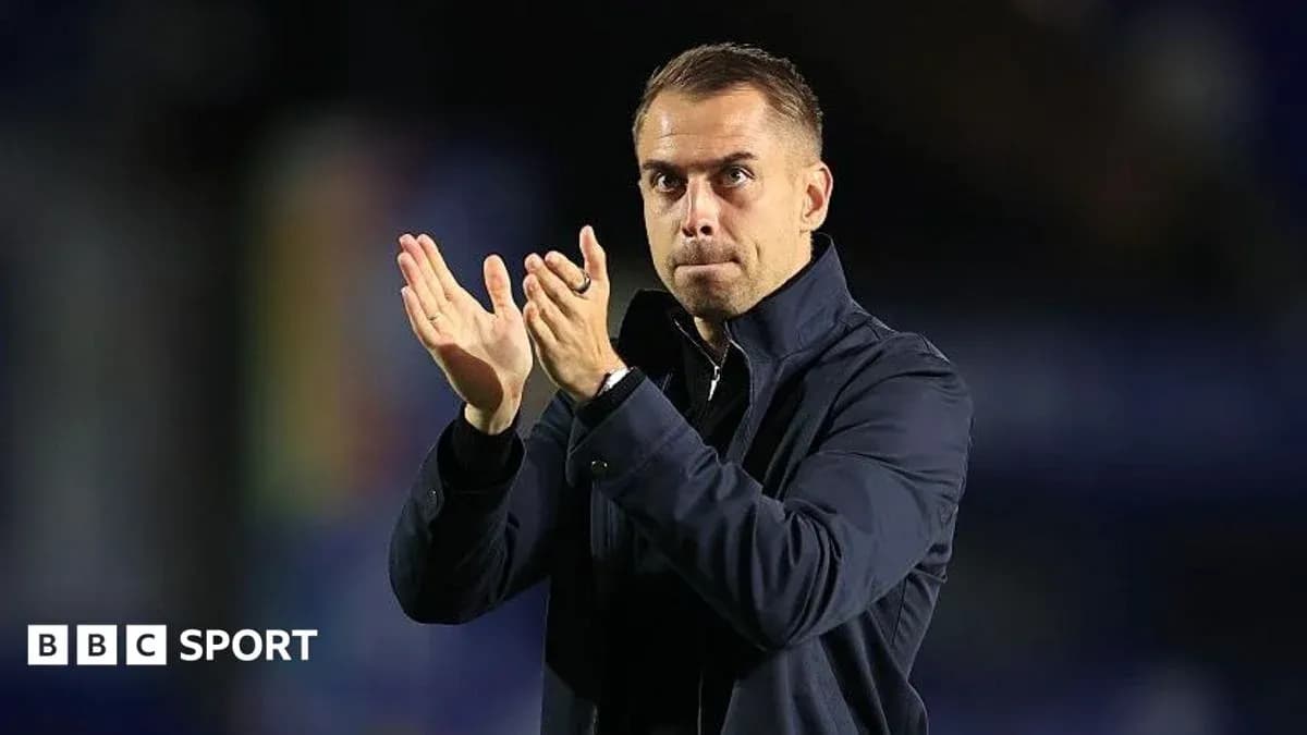 Manager applauding during a football match