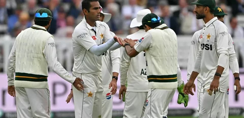 Pakistani cricket team celebrating a wicket on field
