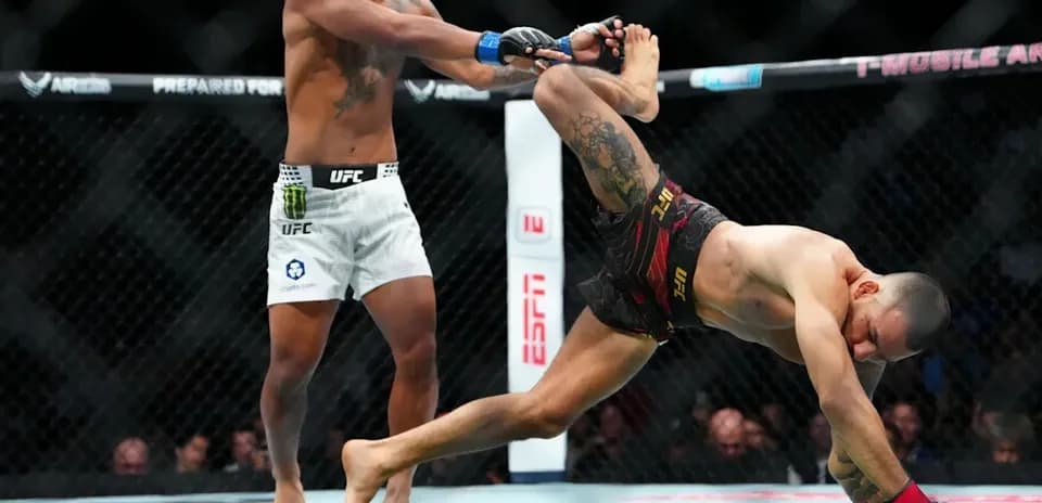 Fighter performing a takedown in UFC match