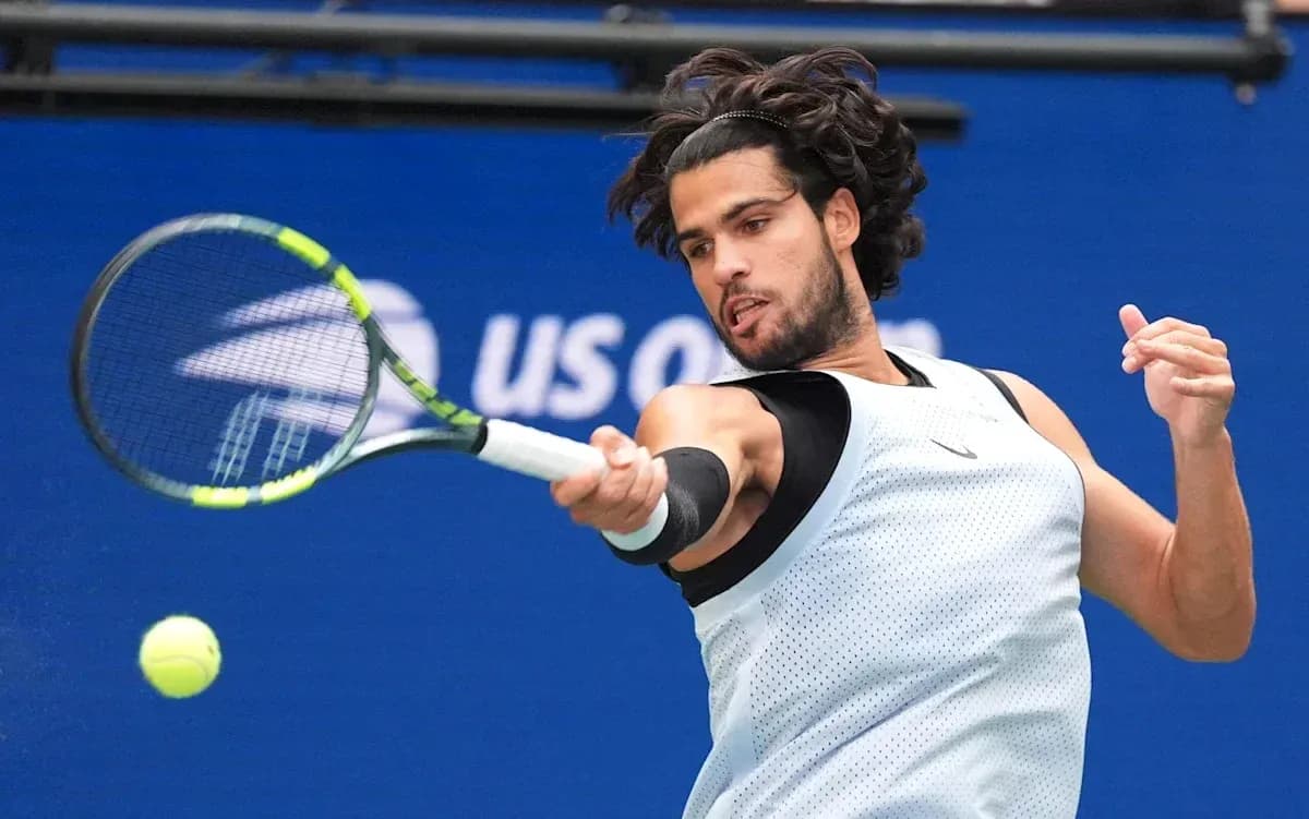 Player hitting a tennis ball during a match