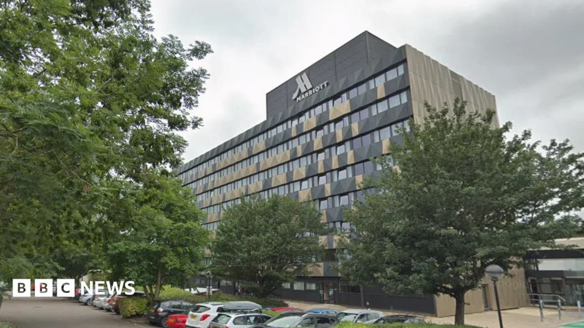 Marriott hotel building with surrounding trees
