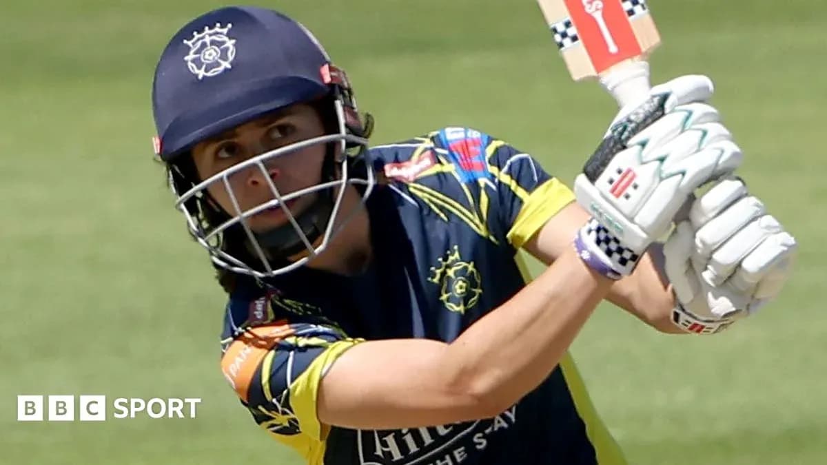 Batter preparing to hit the ball in cricket match