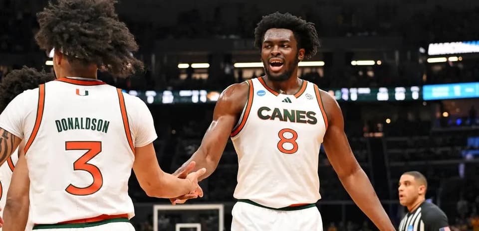 Miami players celebrating during NCAA tournament game