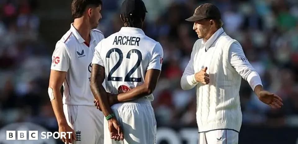 Three cricketers discussing strategy on the field