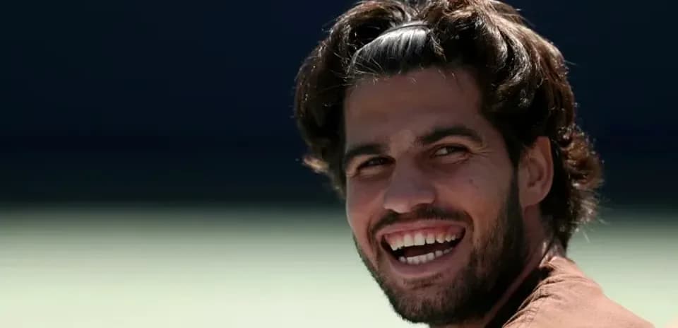 Tennis player smiling during training session