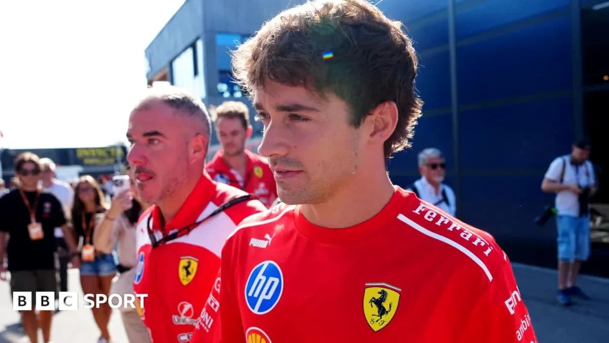 Formula 1 driver walking in Ferrari team shirt