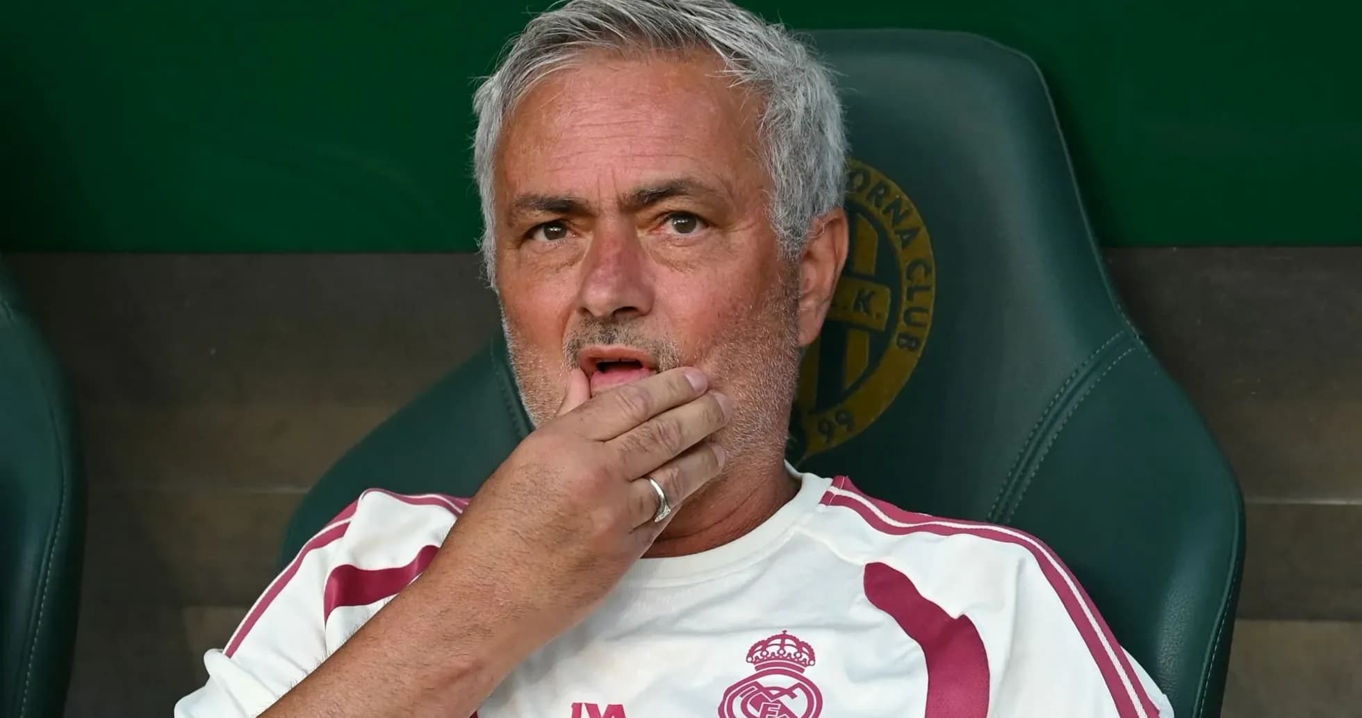 Coach sitting on the bench during a match