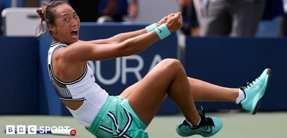 Tennis player celebrating on court after winning match