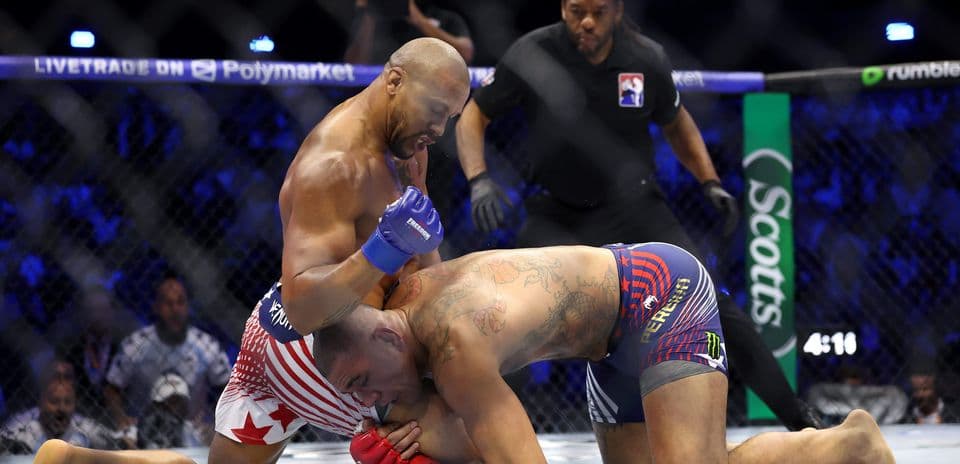 Fighters grappling during MMA match in octagon