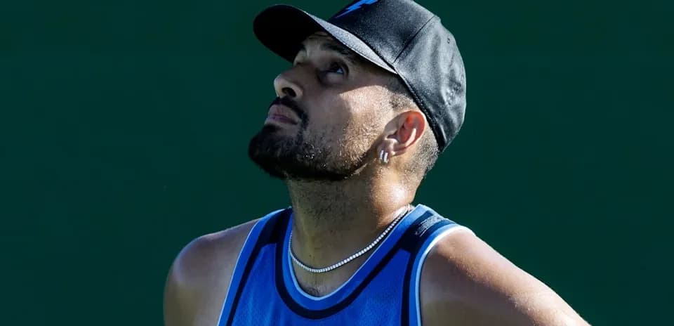 Tennis player looking up during match