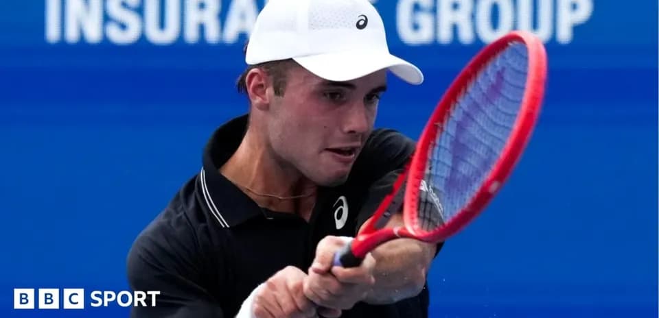 Tennis player hitting a forehand shot on court