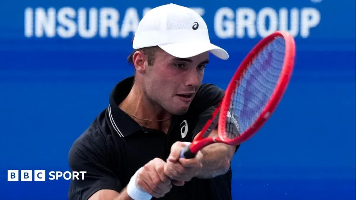 Tennis player hitting a forehand shot on court