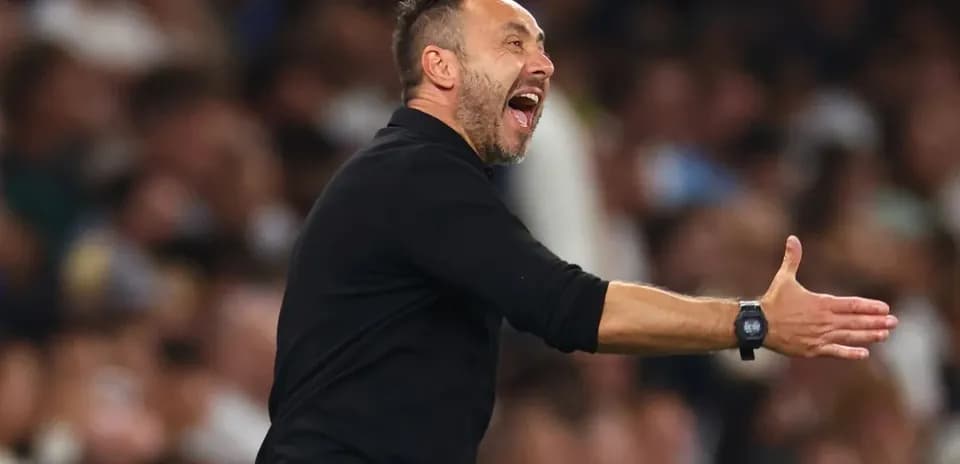 Coach gesturing during a match on the sidelines