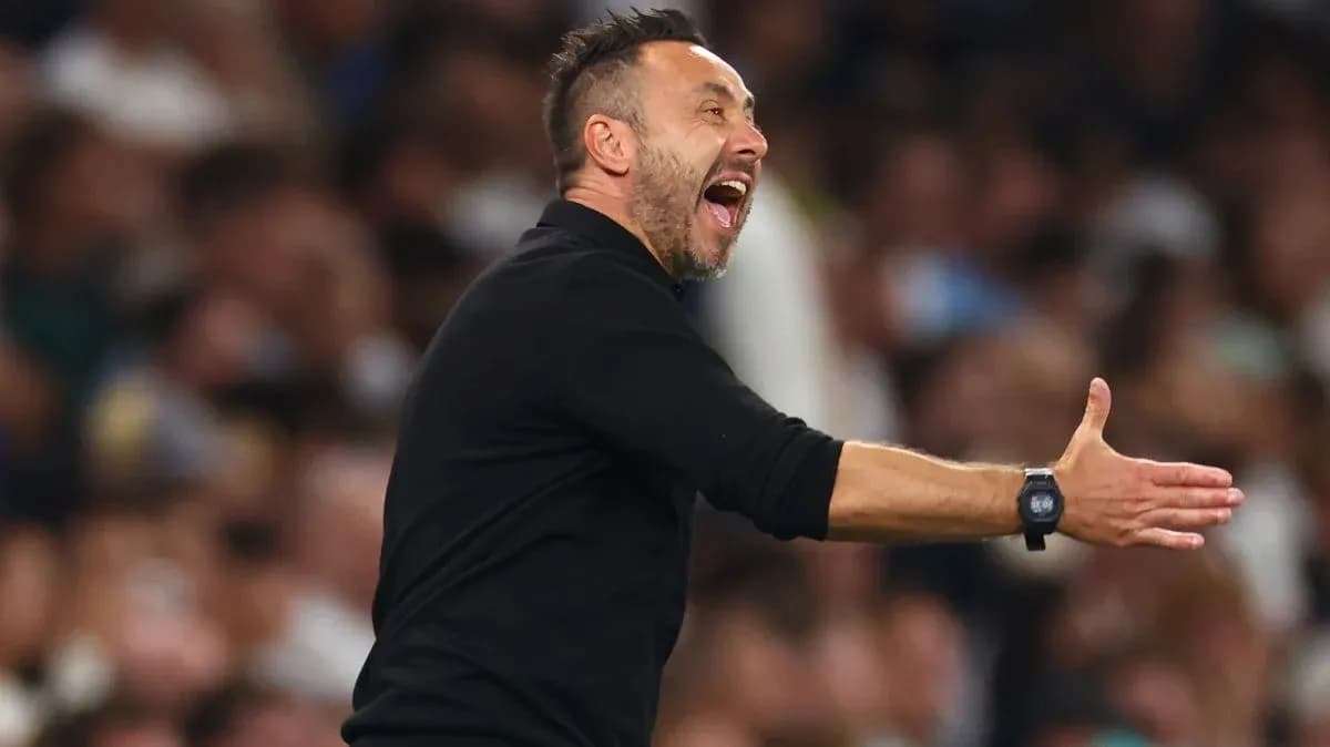 Coach gesturing during a match on the sidelines