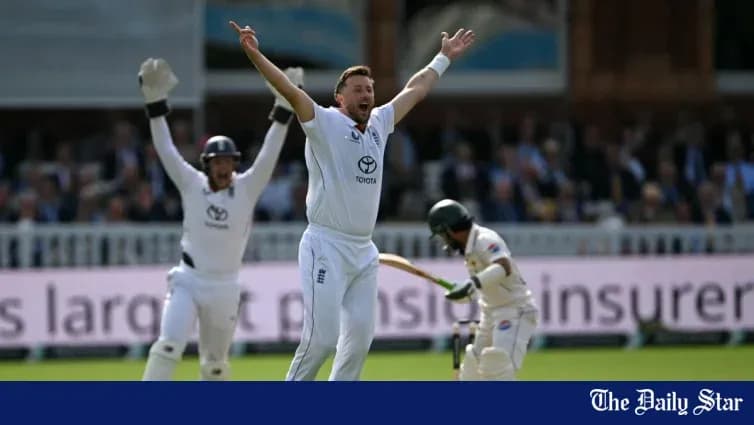 Bowler celebrating a wicket with teammates during match