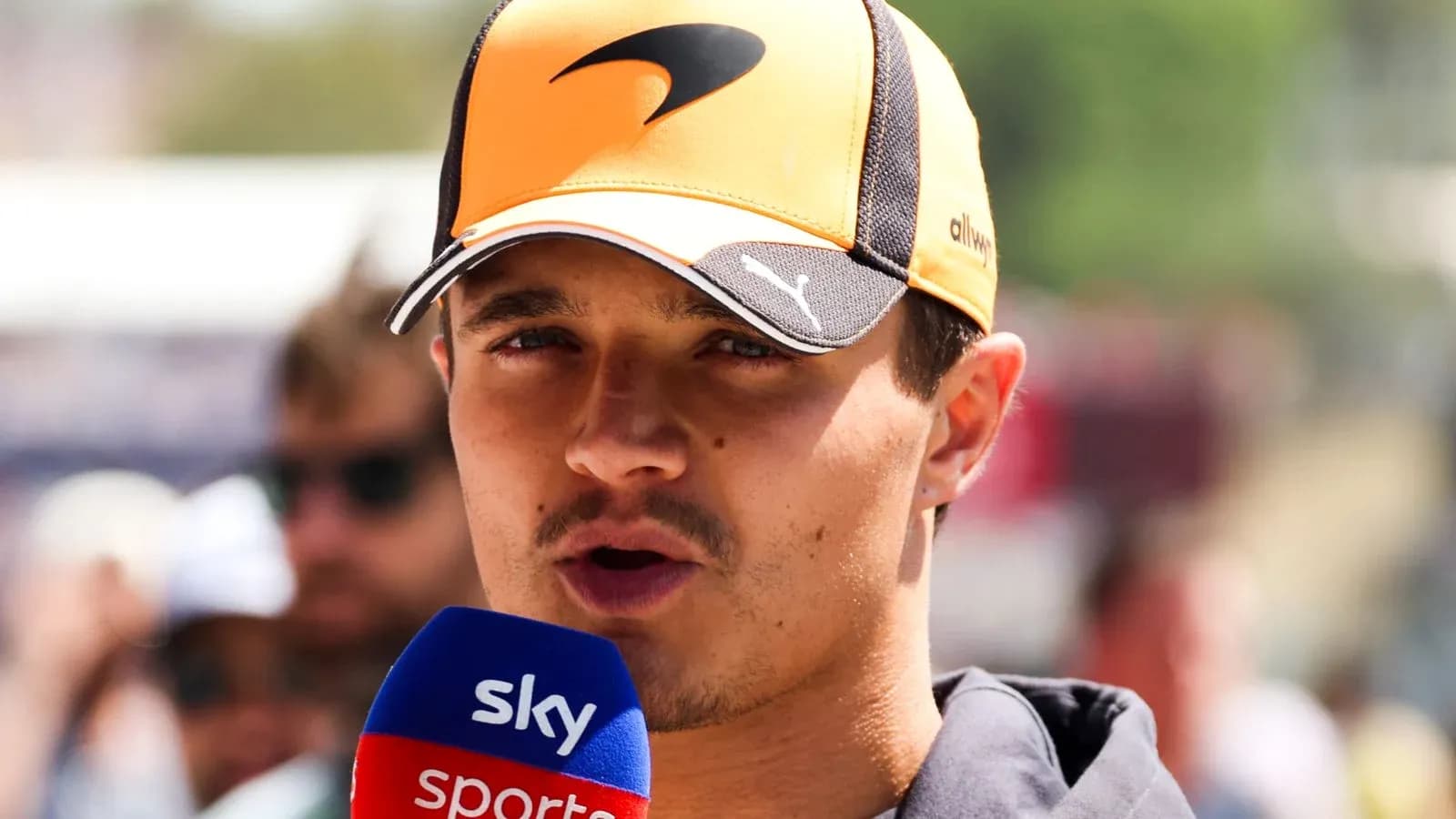 Driver speaking into microphone during event