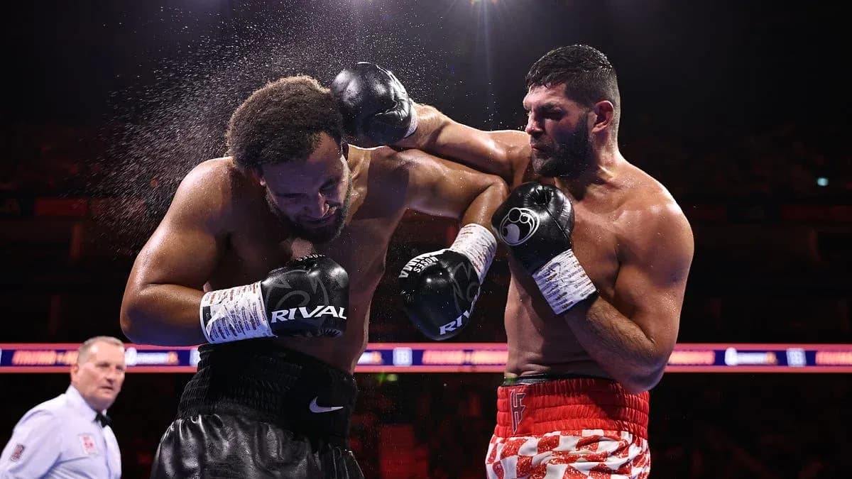 Boxers exchanging punches in the ring during match Boxers exchanging punches in the ring during match