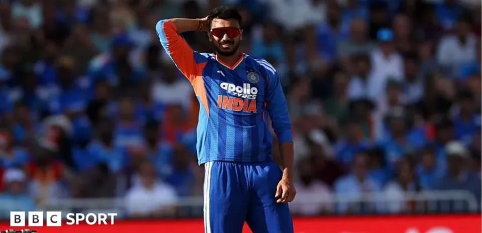 Cricketer in India jersey gesturing during match