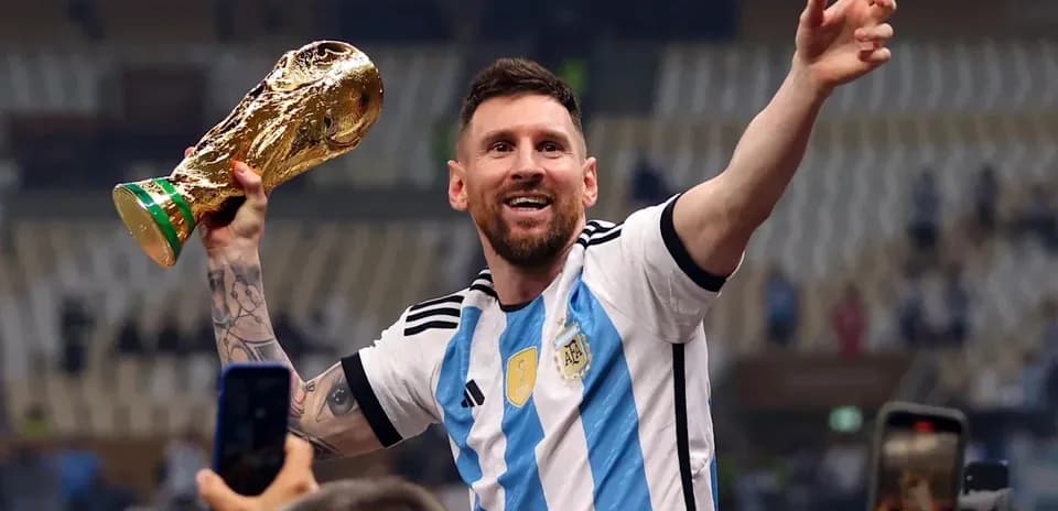 Player celebrating with FIFA World Cup trophy