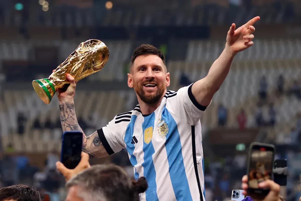 Player celebrating with FIFA World Cup trophy