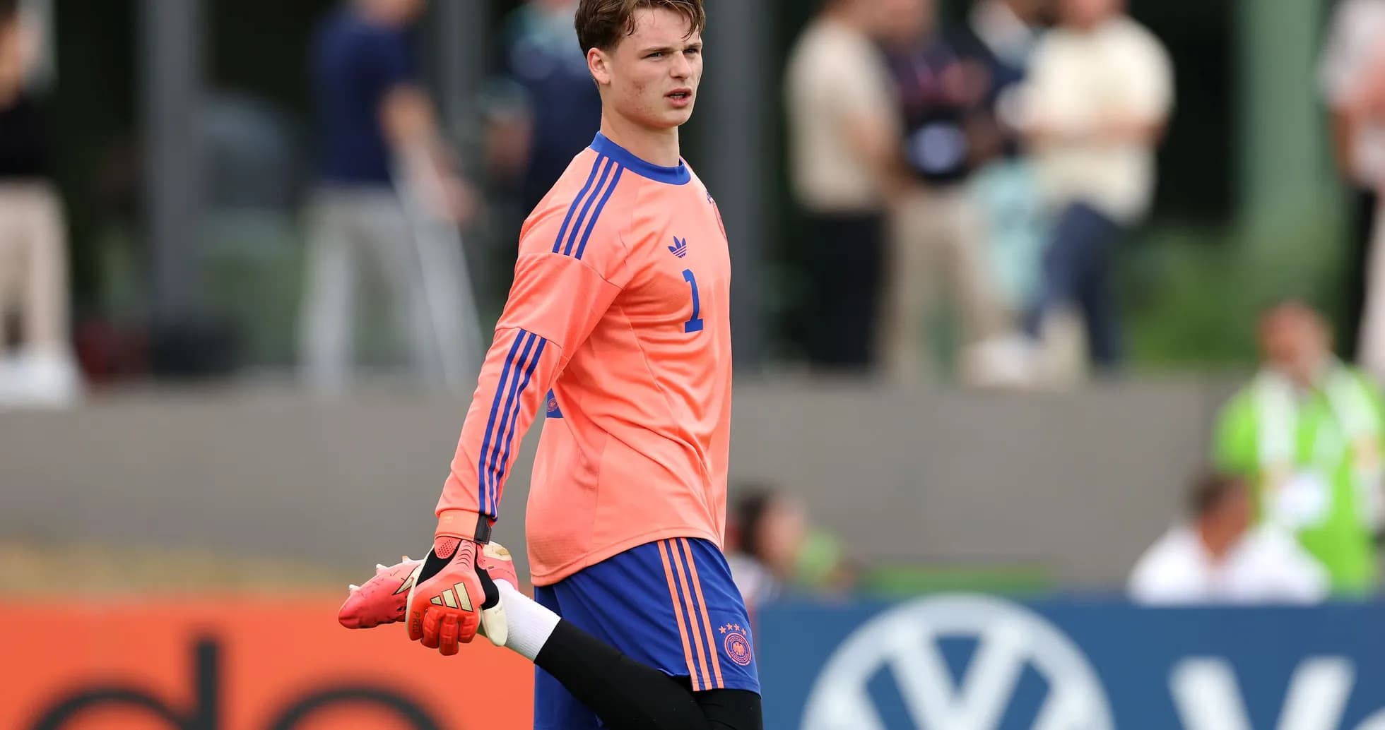 Goalkeeper stretching during warm-up session
