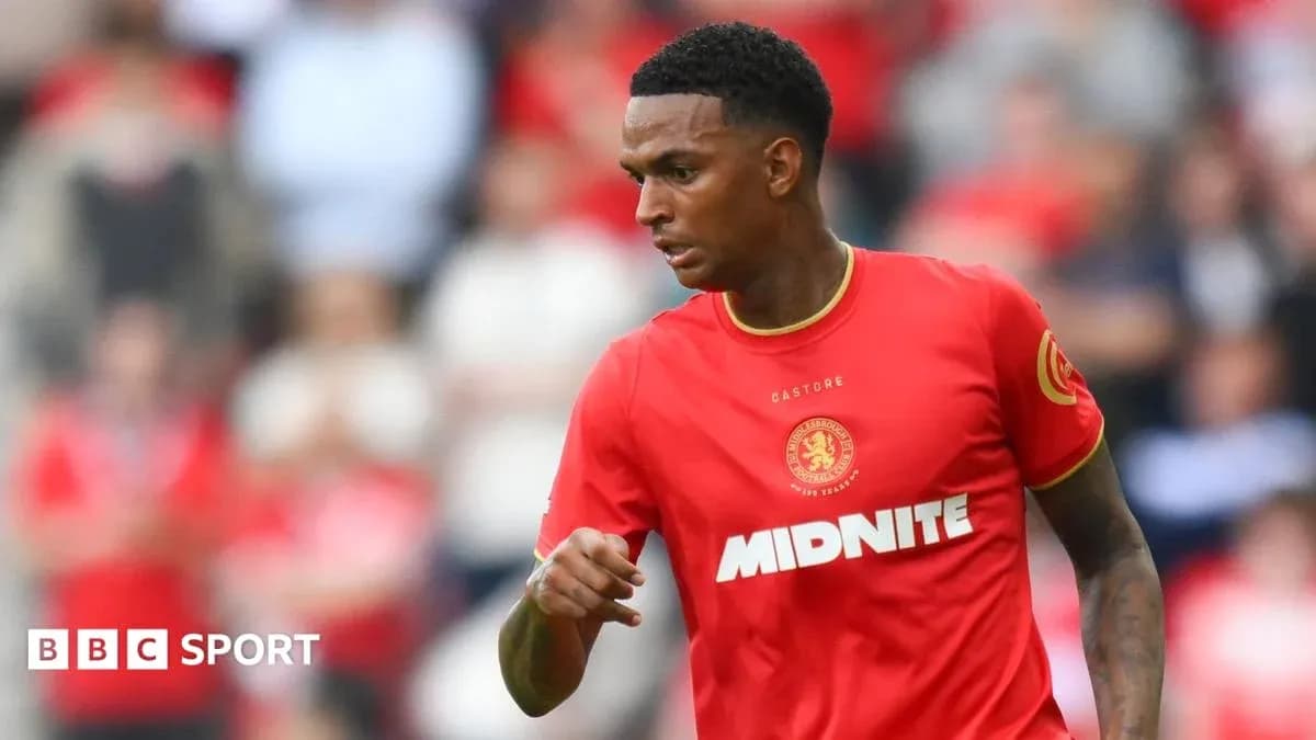Player in red kit during match action