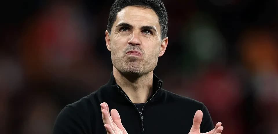 Coach applauding during post-match celebrations