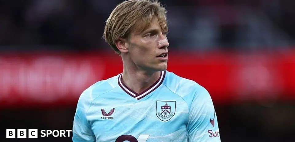 Player in light blue Burnley jersey during match