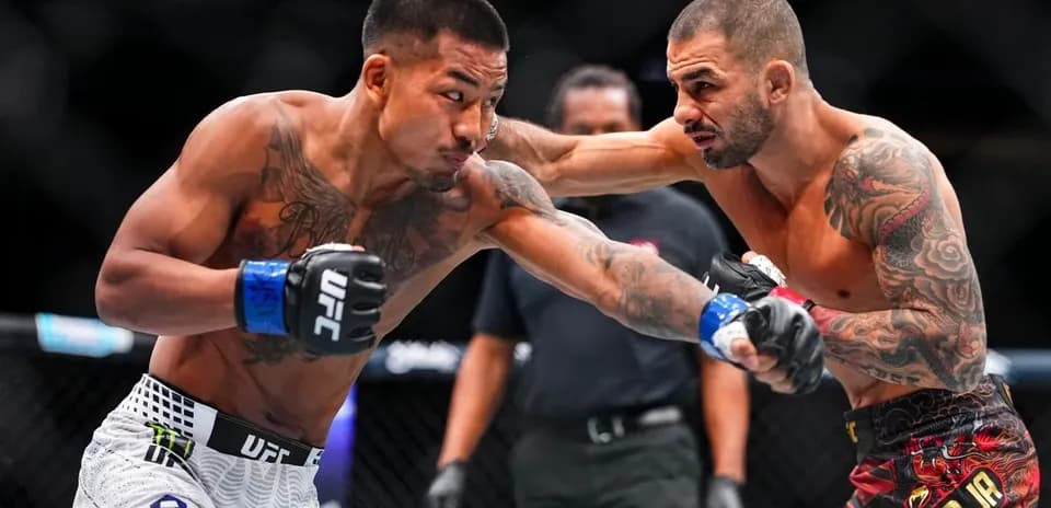 Two fighters exchanging punches in the octagon