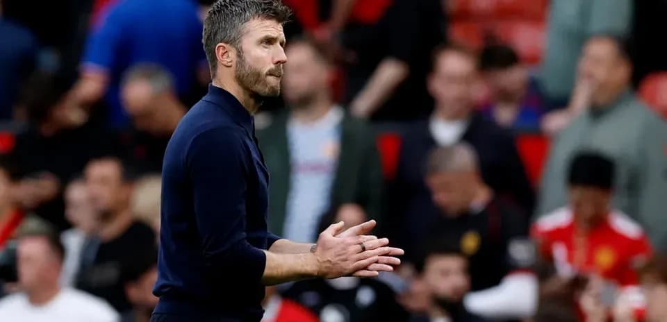 Coach gesturing on the sideline during match