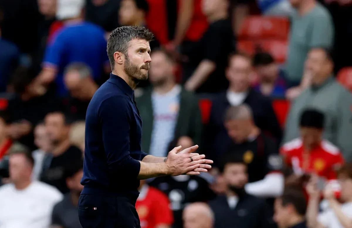 Coach gesturing on the sideline during match