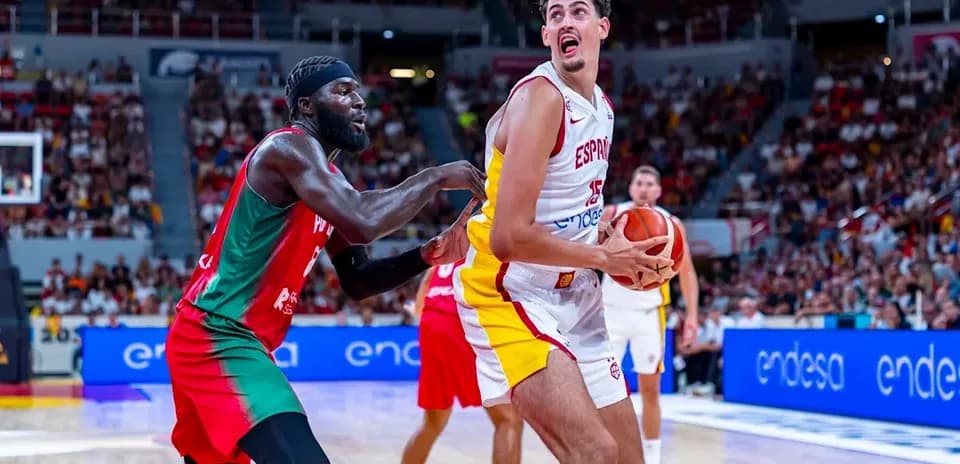 Player from Spain being guarded during basketball game