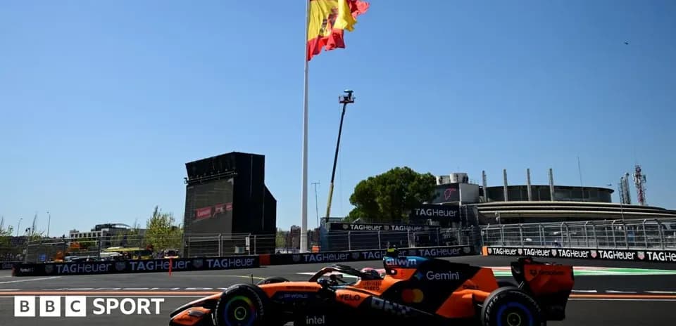Formula 1 car on track with Spanish flag background