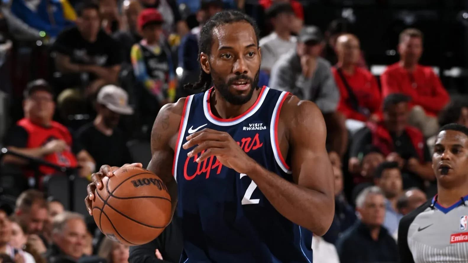 Player dribbling basketball during game action