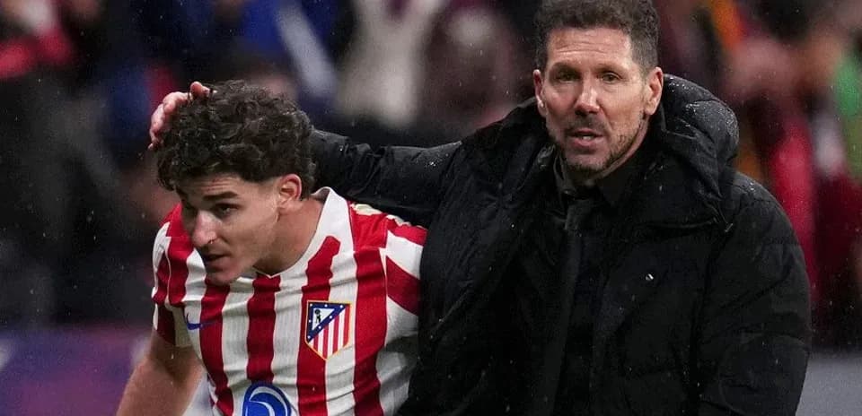 Atletico Madrid player assisted by coach after match