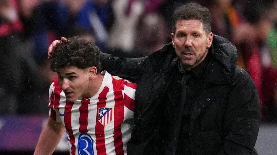 Atletico Madrid player assisted by coach after match