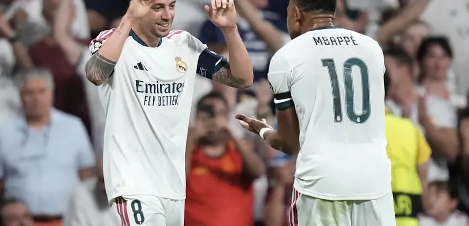 Real Madrid players celebrating a goal together