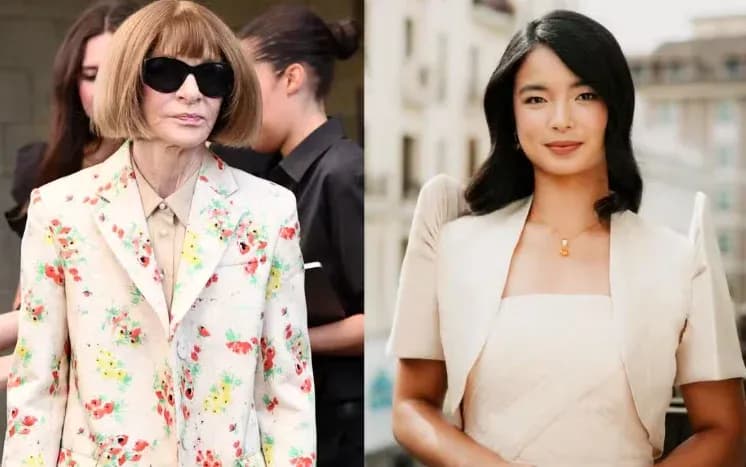Two women in fashionable outfits, one in floral suit