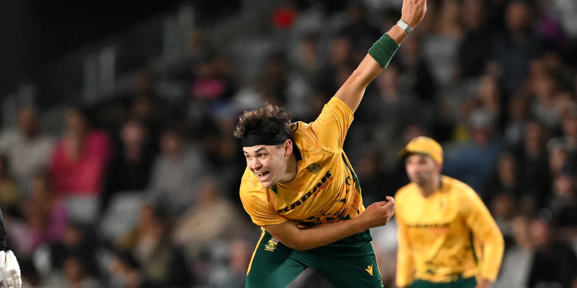Bowler delivering ball during cricket match