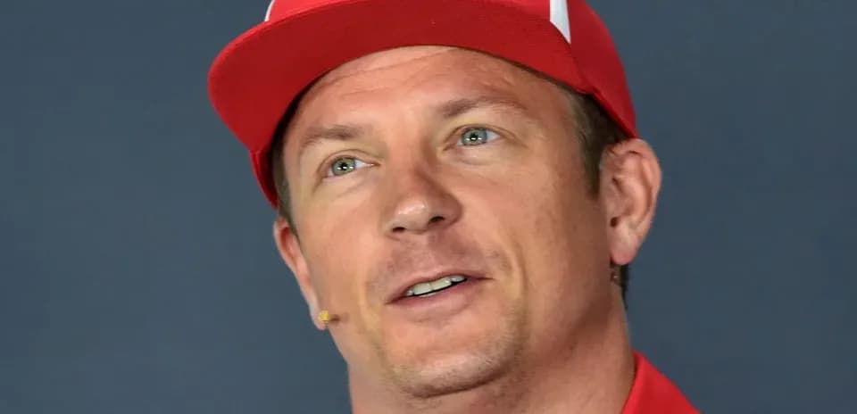 Driver wearing red cap during press conference