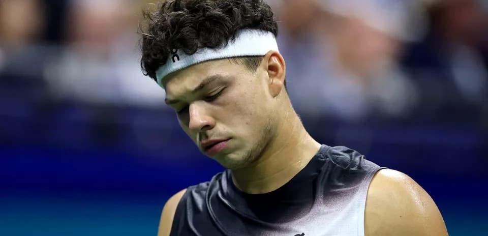 Tennis player looking down on court during match
