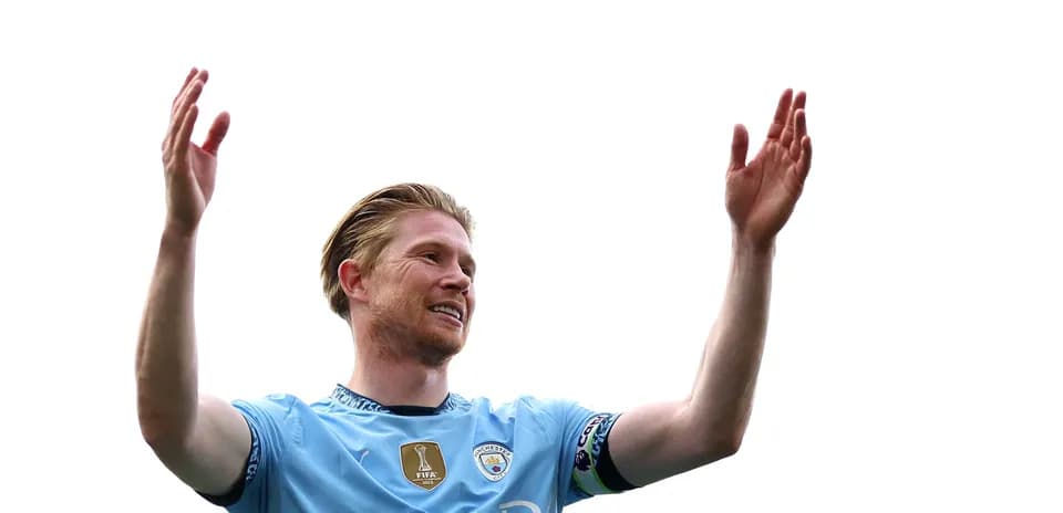 Player celebrating with raised hands on pitch