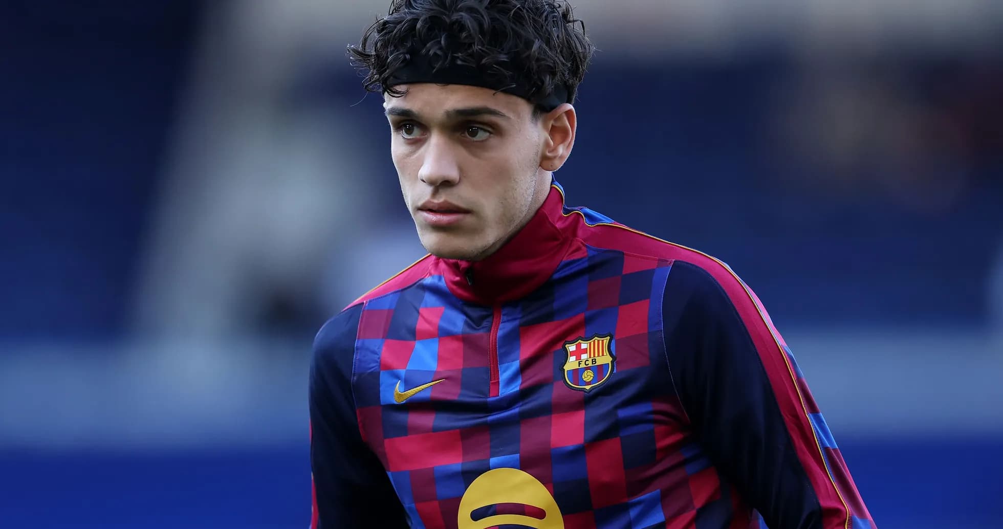 Player in FC Barcelona training gear on pitch