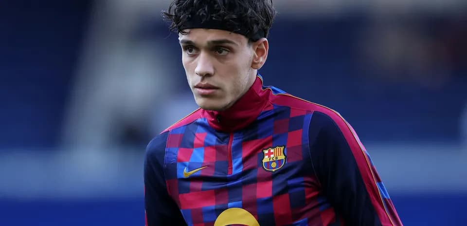Player in FC Barcelona training gear on pitch